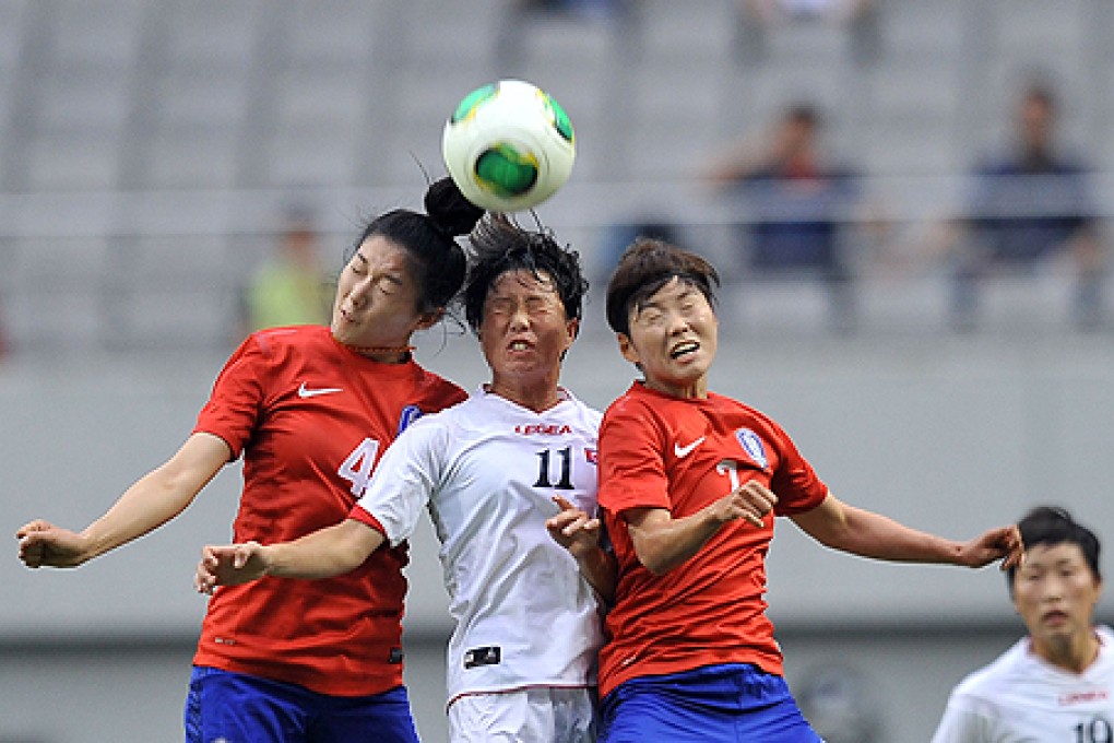 North Korea's Ri Ye-gyong (centre) competes with South Korea's Shim Seo-yeon (left) and Jeon Ga-eul. Photo: AFP