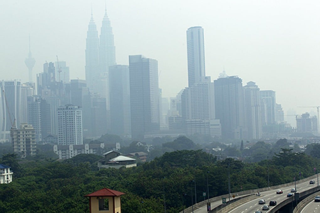 The Kuala Lumpur city skyline is covered by haze in Malaysia, on Monday. Photo: EPA