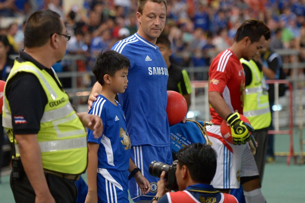 Chelsea captain John Terry got caught up in controversy when Supasek Amornchat, son of Thai Prime Minister Yingluck Shinawatra, replaced another boy last week. Photo: AFP