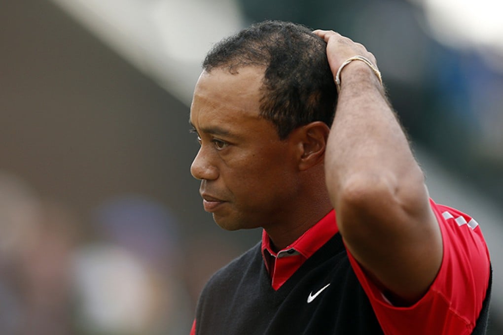 Tiger Woods of the United States reacts on the 18th green. Photo: AP
