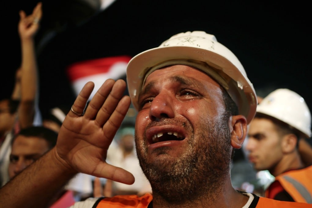 Supporters of the Muslim Brotherhood attend a protest in support of ousted President Mohammed Mursi outside the Rabaa al-Adawiya mosque in in Cairo. Photo: EPA