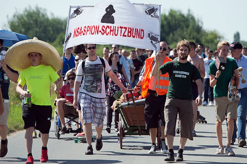 Anti-spying demonstrators protest outside a US National Security Agency listening station in Griesheim near Darmstadt, Germany. Photo: AFP