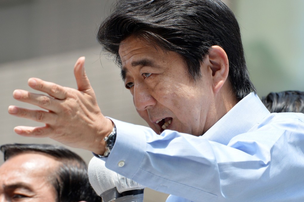 Japanese Prime Minister Shinzo Abe has been boosted by a report saying the economy continues to strengthen. Photo: AFP