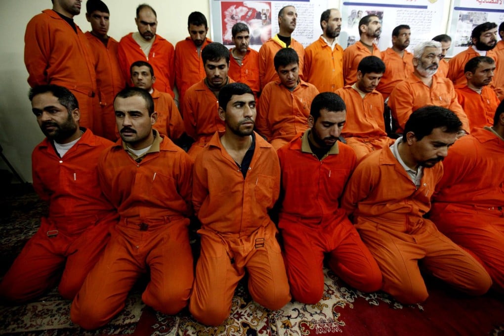 Handcuffed al-Qaeda suspects in Baghdad in 2010.