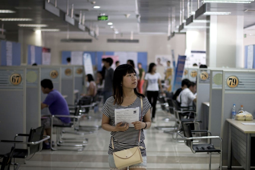 A Chinese woman visits a job fair held at the Zhongguancun Talent Center in Beijing. Photo: AP