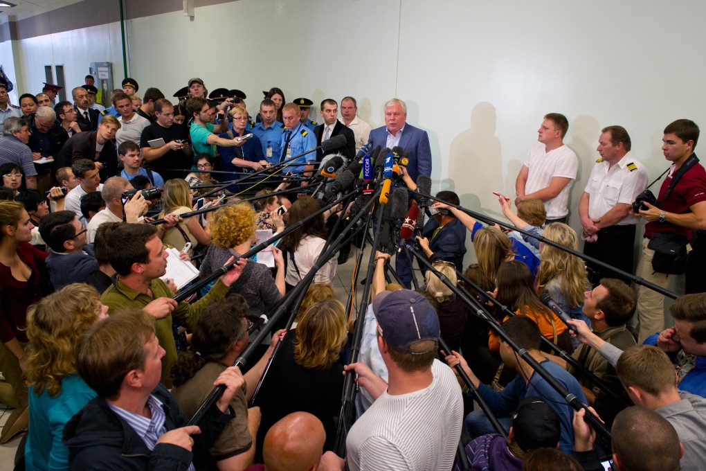 Lawyer Anatoly Kucherena speaks to the media at the Sheremetyevo Airport in Moscow. Photo: Xinhua