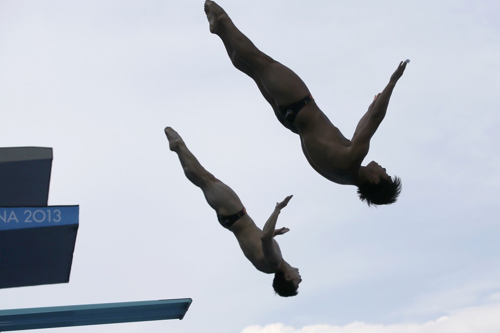 China's Qin and He at the men's synchronised 3m springboard final during the World Swimming Championships in Barcelona. Photo: Reuters