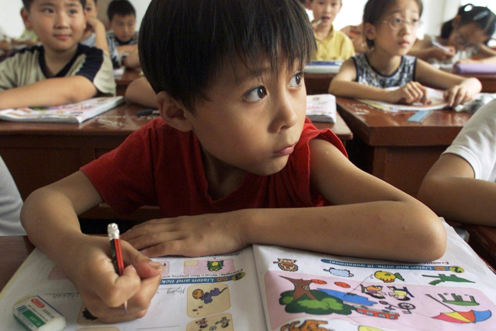 Young Sun Minyi brushes up on his English during an extra class in Shanghai. Photo: Reuters