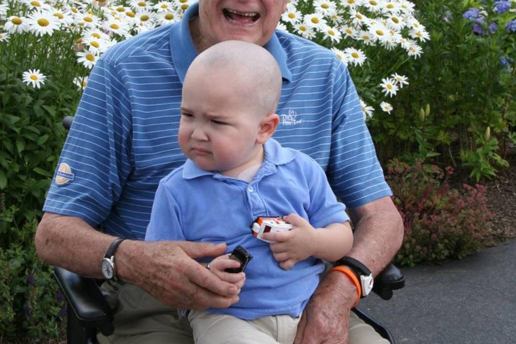 George H. W. Bush with Patrick, two, who is suffering from leukaemia.Photo: Reuters