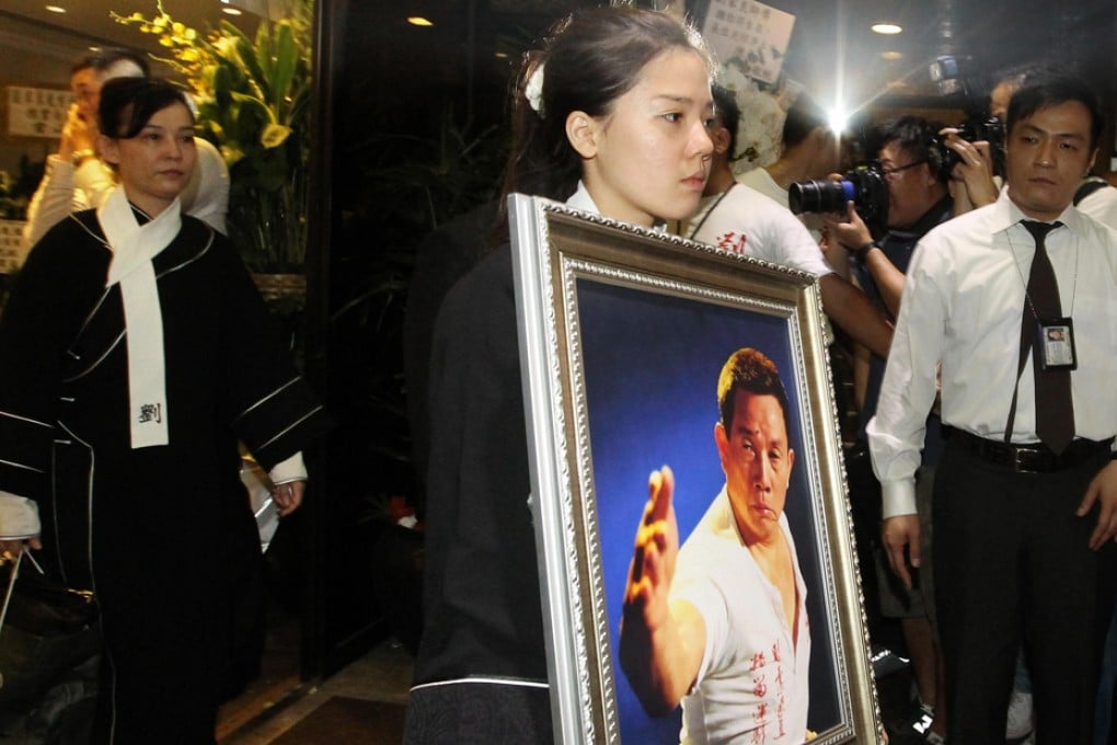 The service for Lau Kar-leung at the Universal Funeral Parlour in Hung Hom. Lau's wife (left) Mary Jean Reimer walks behind their daughter Jeanne Lau. Photo: Edward Wong