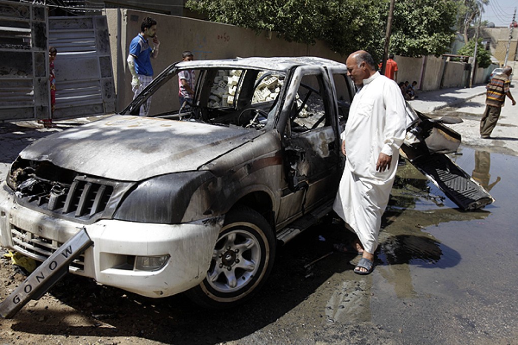 The aftermath of a car bomb attack in Baghdad. Photo: AP