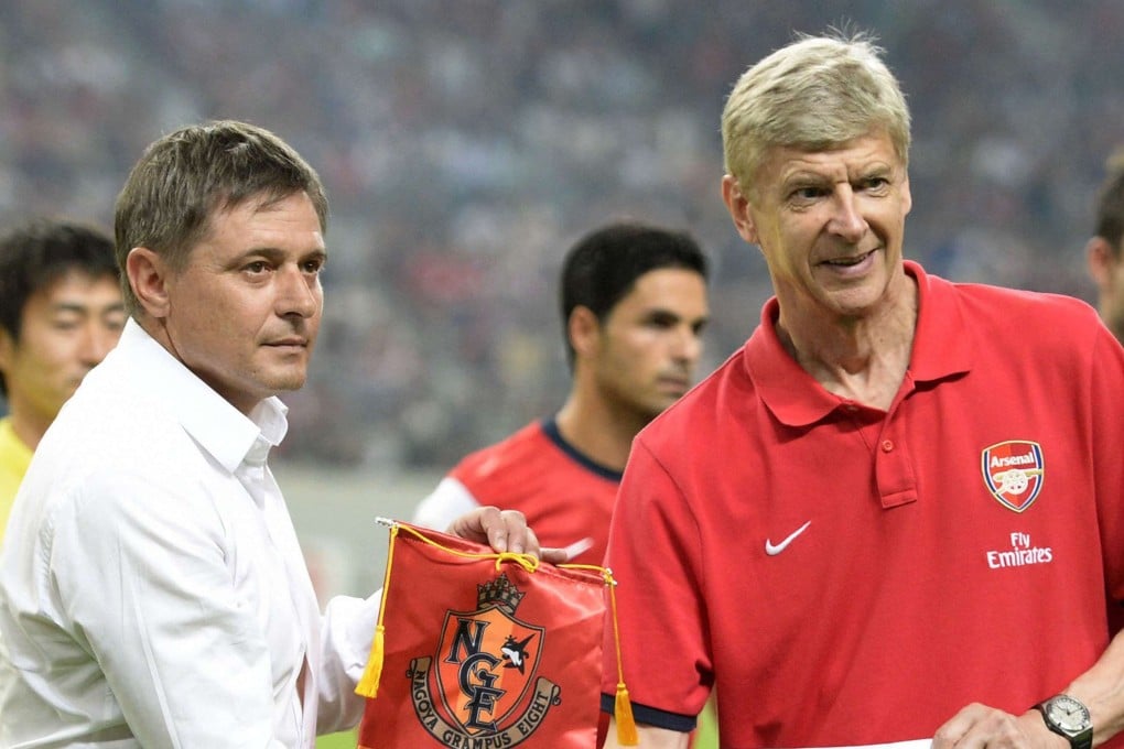 Arsenal's head coach Arsene Wenger (right) shakes hands with Nagoya Grampus manager Dragan Stojkovic before their friendly soccer match as part of Arsenal's Asia Tour 2013 in Toyota, central Japan. Photo: Reuters