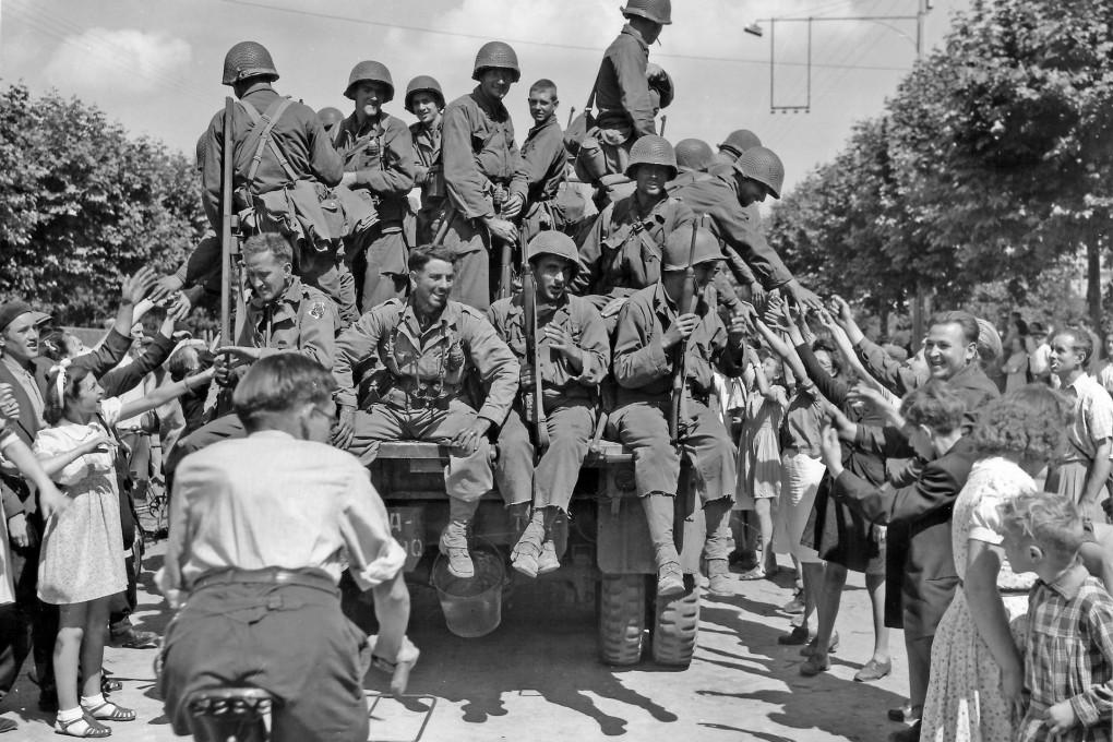 Parisians greet US troops in the liberated French capital on August 29, 1944. About 50,000 Americans went AWOL in the second world war. Photo: Corbis