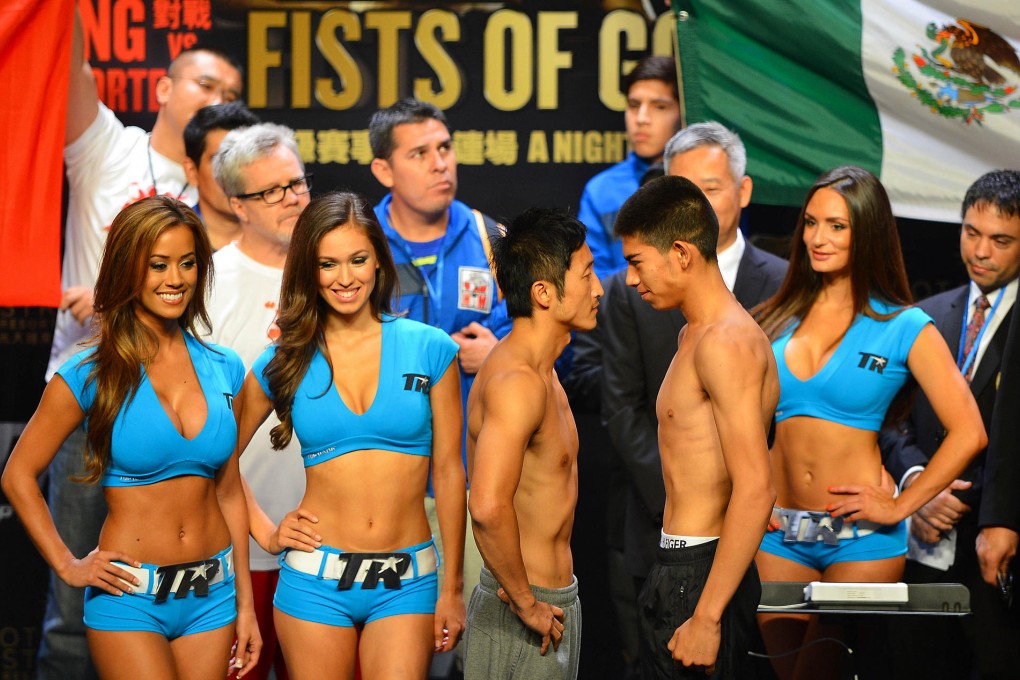 Zou Shiming and Jesus Ortega come face to face at the weigh-in before their highly anticipated flyweight bout in Macau tonight. Photo: Xinhua.