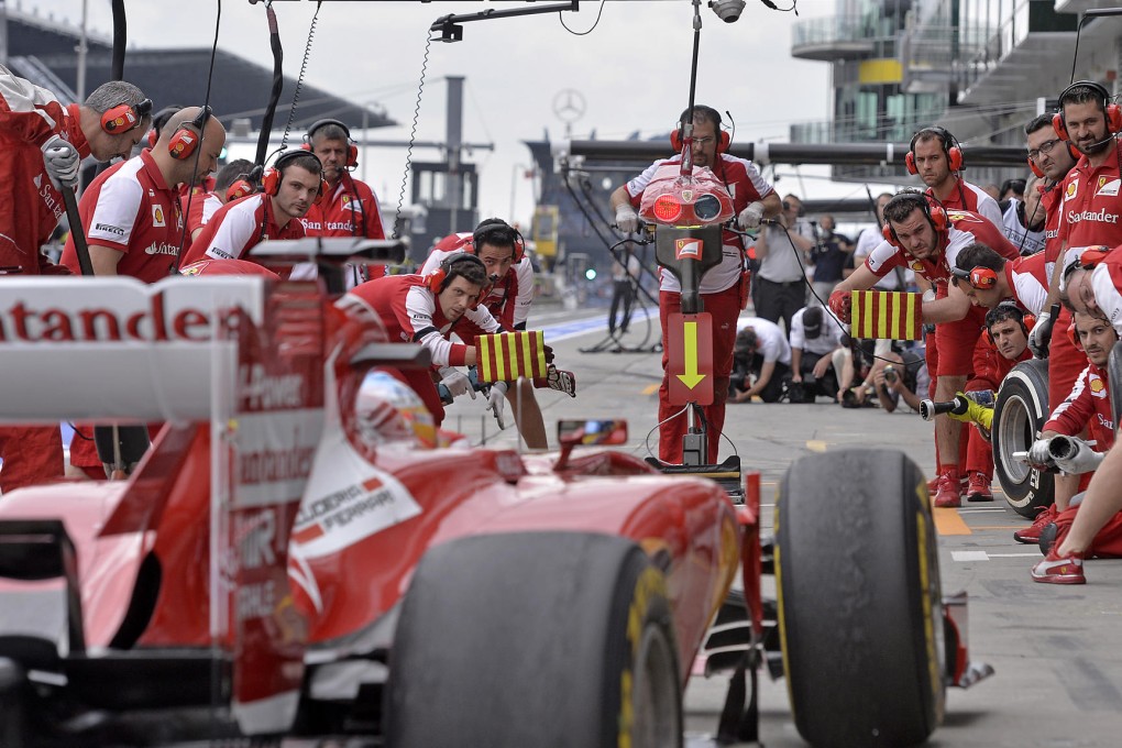 Ferrari driver Fernando Alonso of Spain makes a pit stop during practice at the Nuerburgring track in Germany. Photo: AP