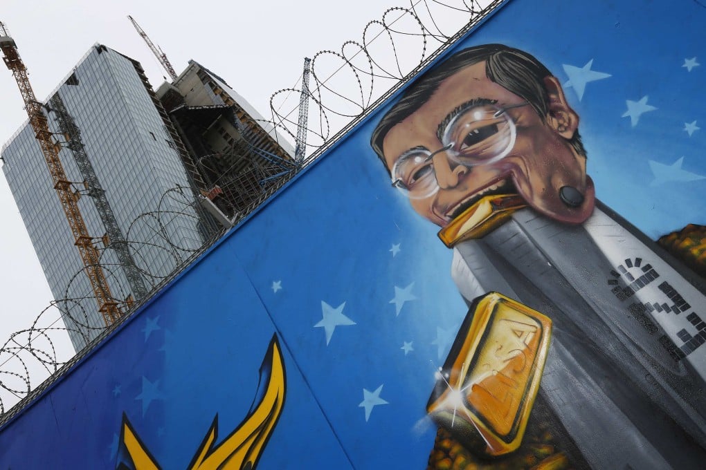 A caricature of ECB head Mario Draghi decorates the building site for the European Central Bank’s new headquarters. Photo: Reuters