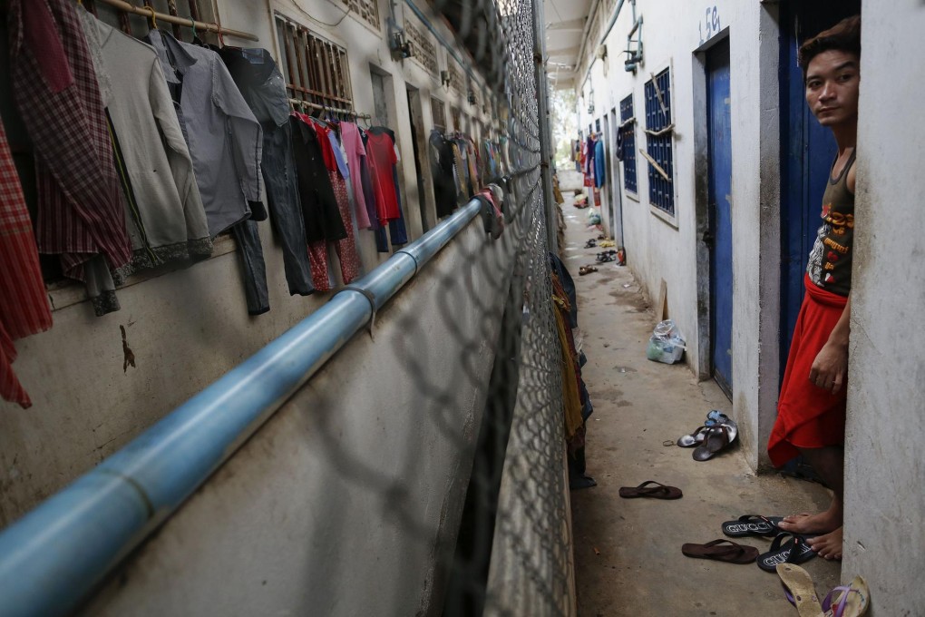 Cambodian garment workers, who typically arrive from the provinces to work in the capital, live four or more to a small room in crowded buildings like this one in the southeastern suburbs of Phnom Penh