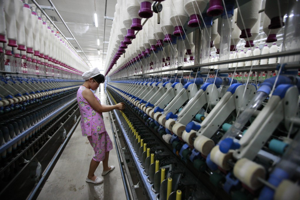 A labourer working in a textile factory in Huaibei, in north China's Anhui province. Photo: AFP