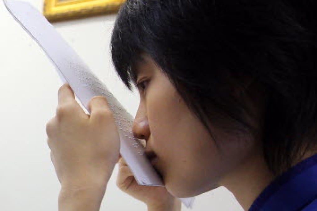 Tsang Tsz-kwan, the blind girl who achieved outstanding results in Diploma of Secondary Education exams shows a good example of Hong Kong's 'can-do' spirit. Photo: Jonathan Wong