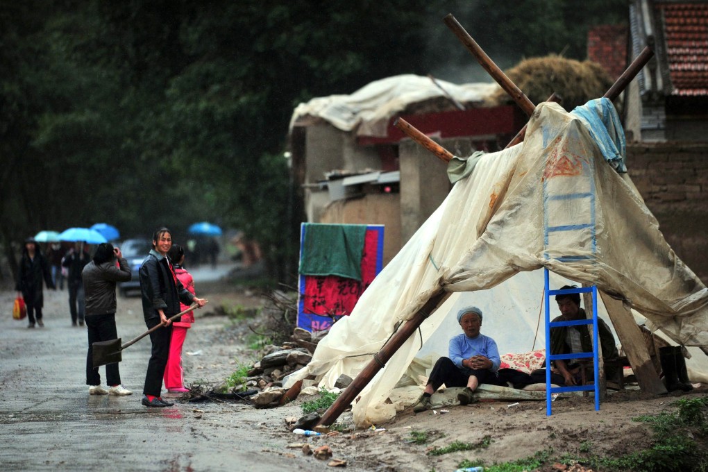 Earthquake-hit villagers living in a temporary tent in Minxian county in Dingxi, northwest China's Gansu province. Photo: AFP