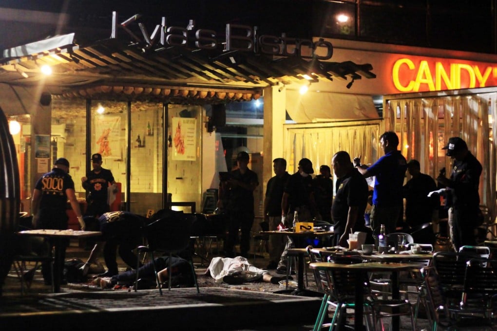 Police examine the blast scene at Kyla's Bistro in Cagayan de Oro. The restaurant was crowded at the time of the explosion. Photo: EPA