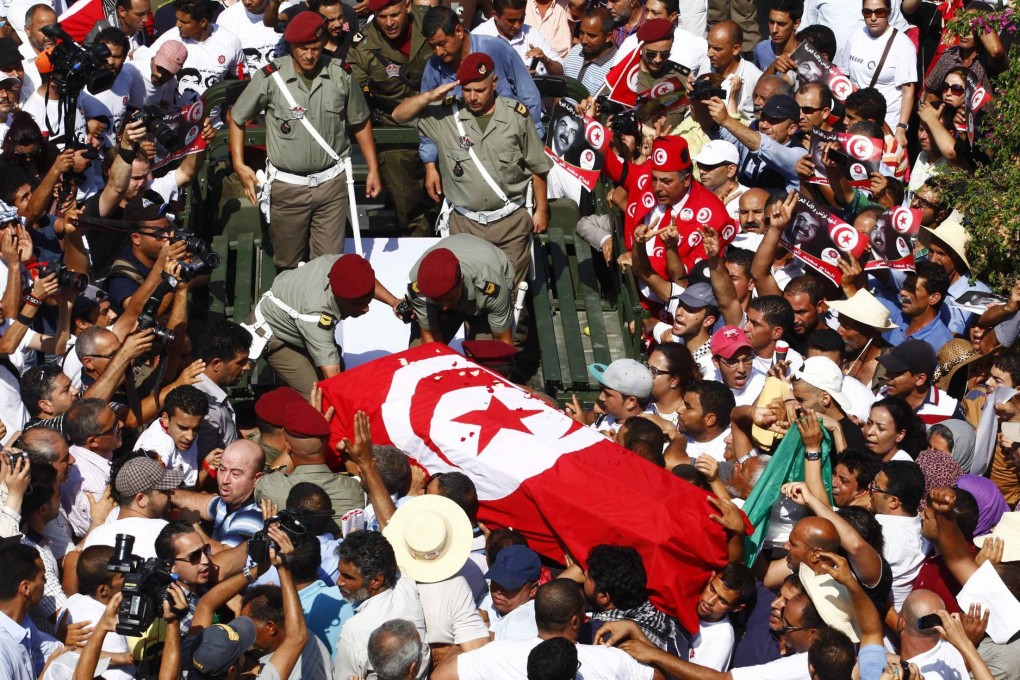 Mourners carry Mohammed Brahmi's coffin. Photo: Reuters
