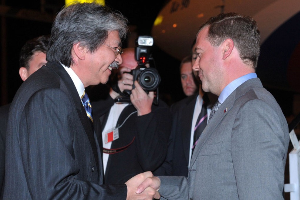 Dmitry Medvedev (right) meets Financial Secretary John Tsang in 2011. Photo: AP