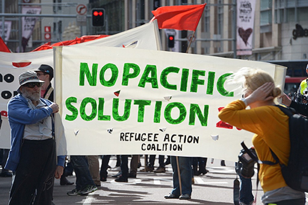 Demonstrators march through central Sydney on July 20 following the launch on July 19 of a hardline Australian government immigration crackdown. Photo: AFP