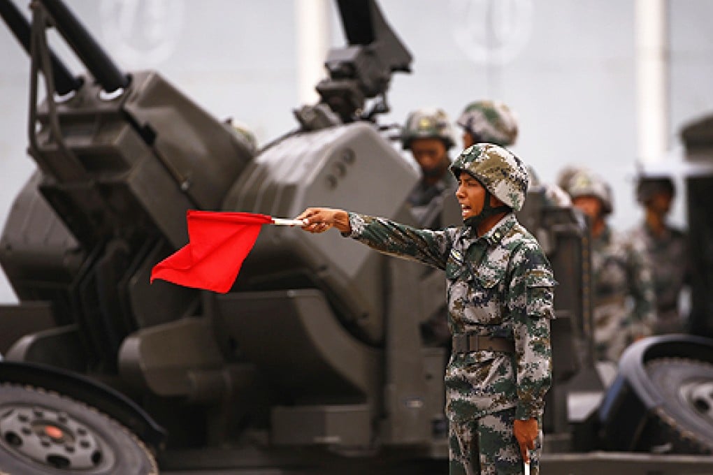A soldier from Air Defence Brigade, 47th Combined Corps, PLA performs during a display organised by the government in Lintong, Shaanxi province, on Monday. Photo: Reuters