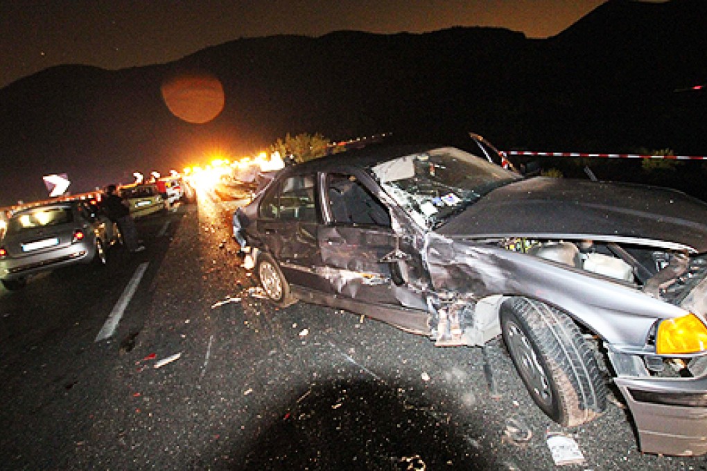 The bus collided with several cars and fell off from an elevated highway. Photo: EPA