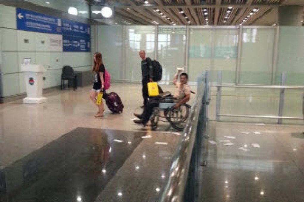 Ji Zhongxing (man on the wheelchair) set off a home-made explosive device at Beijing Capital International Airport to get attention to his complaints. Photo: Xinhua