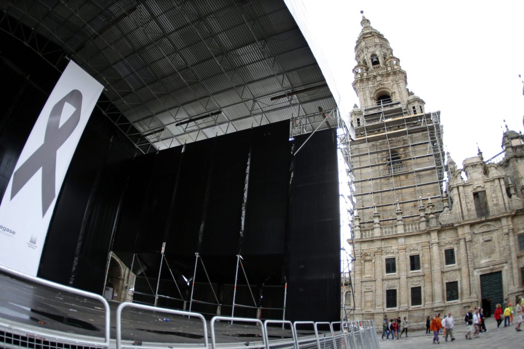 A big black crape in memory of the victims of a derailed train is seen on Quintana square in Santiago de Compostela. Photo: EPA