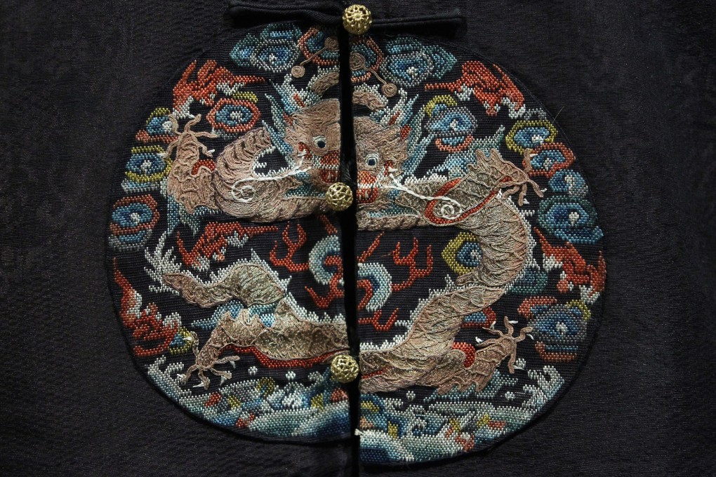 This embroidered surcoat with dragon roundels is among other rare Qing dynasty imperial robes on display. Photo: Edward Wong