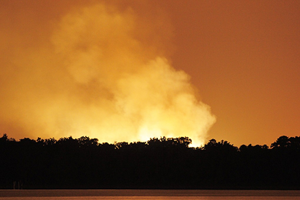 Flames and smoke light up the night sky after a Blue Rhino Propane plant exploded in Tavares, Florida, on Tuesday. Photo: EPA