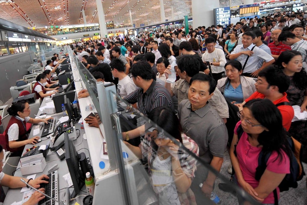 Huge check-in queues at Beijing Capital International Airport, one of eight airports where the new "unrestricted take-off" measure has been implemented. Photo: Xinhua