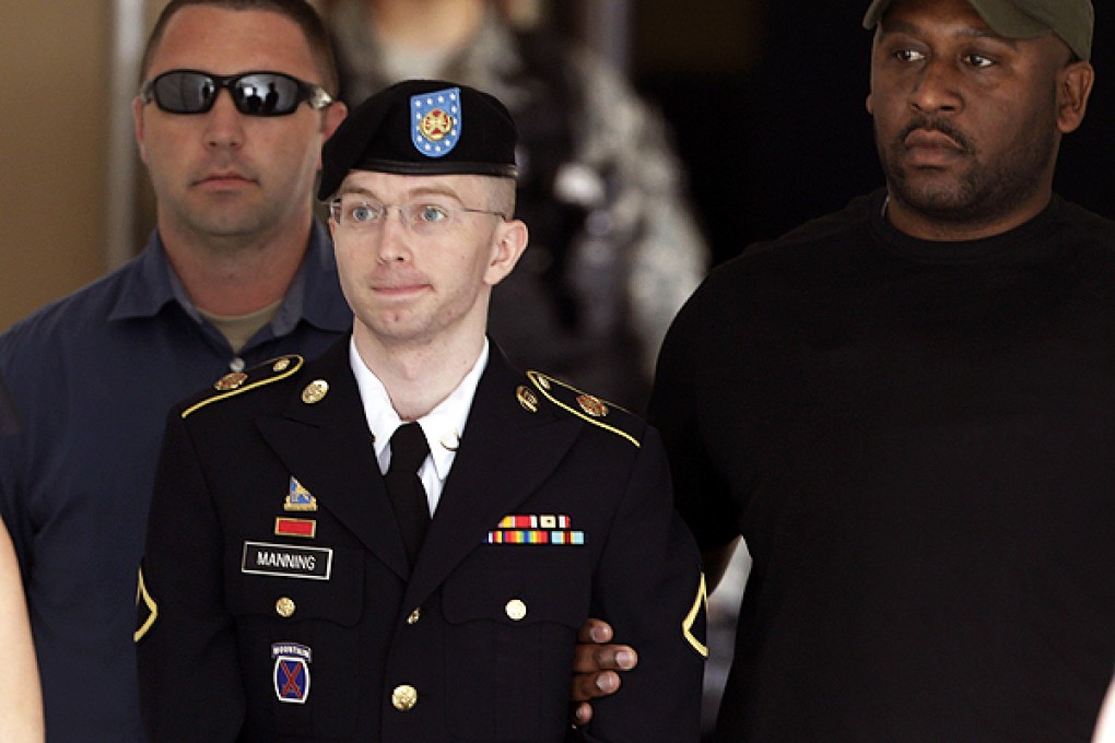 Manning is escorted from Fort Meade courthouse in Maryland. Photo: Reuters