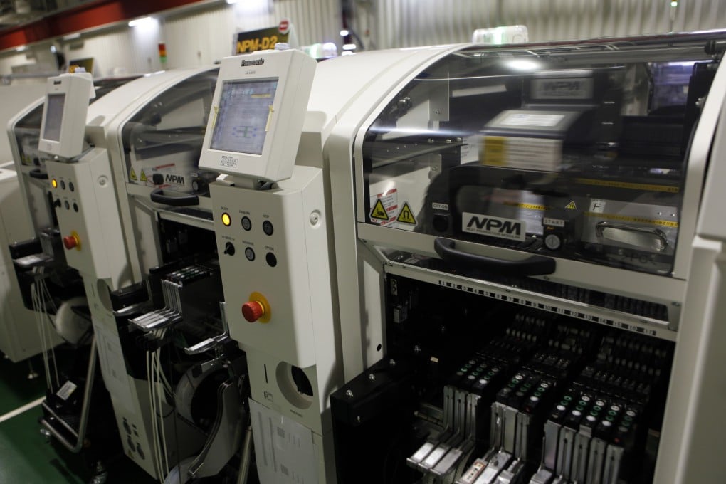 Robotic chip mounters are seen at Panasonic Factory Solutions. Robotics remains a strength in a Japanese electronics industry that has been hammered by competition from rivals in South Korea and Taiwan. Photo: Reuters