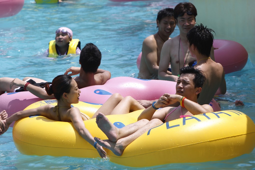 Tourists cool off in a water park in Shanghai. Photo: Xinhua