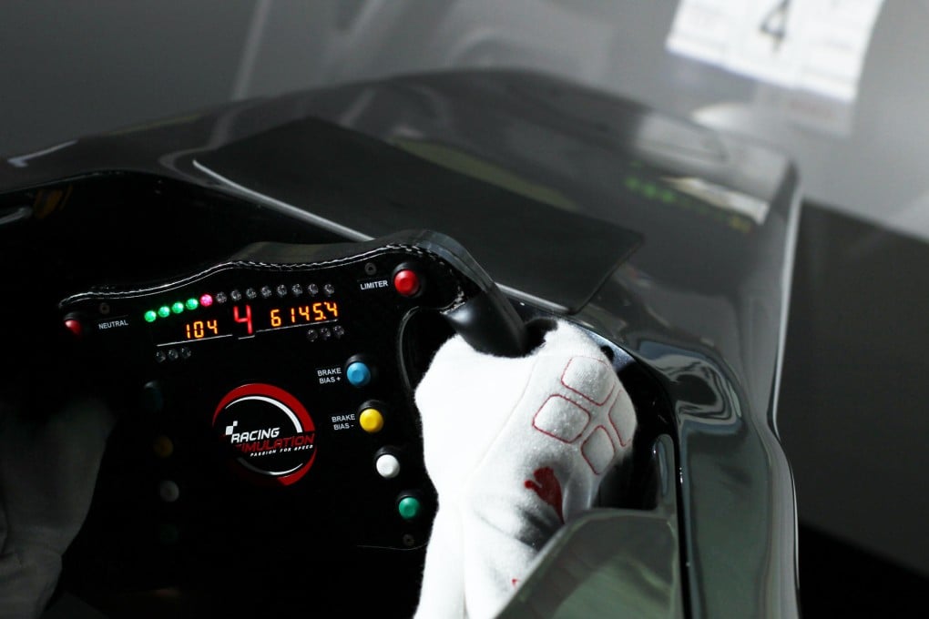 Marchy Leebehind the wheel of aracing simulator. Photos: Nora Tam