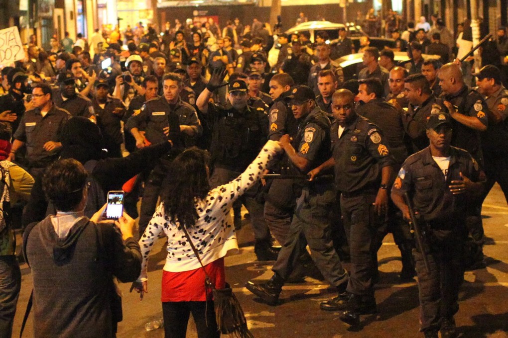 A group of demonstrators faces police during an invasion of the Municipality Chamber of Rio de Janeiro as part of a protest against corruption in the Brazilian capital. Photo: EPA