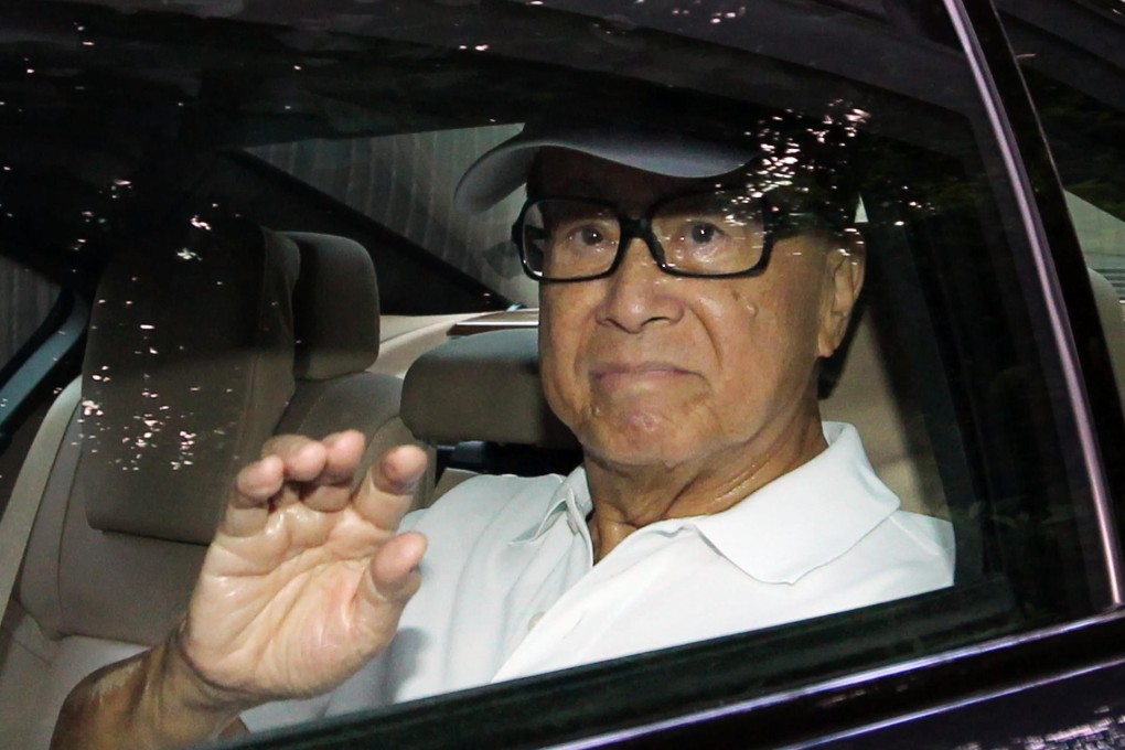 Li Ka-shing, Asia’s richest man, leaves his home in Repulse Bay yesterday – and for once, he was not headed to a results press conference. Photo: Nora Tam