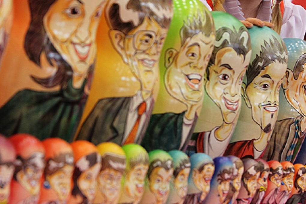Russian nesting dolls bear the faces of Hong Kong icons. Photo: K.Y. Cheng