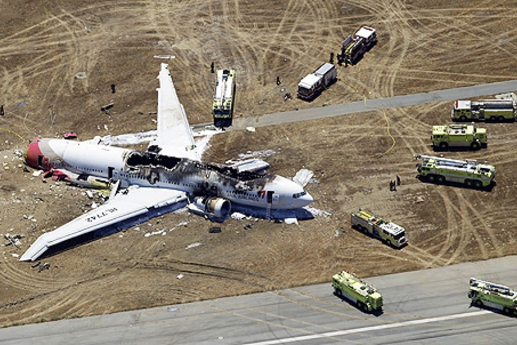 Rescue vehicles surround the wreckage of Asiana Flight 214 at San Francisco International Airport. Photo: AP