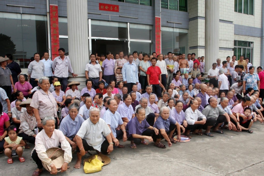 Villagers at the local government building. Photo: Mimi Lau
