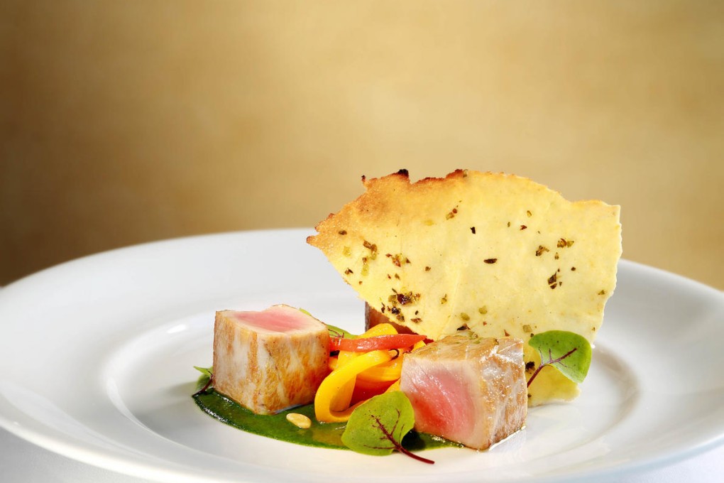 Marinated Mediterranean tuna with fresh herbs and roasted bell peppers at Grissini.