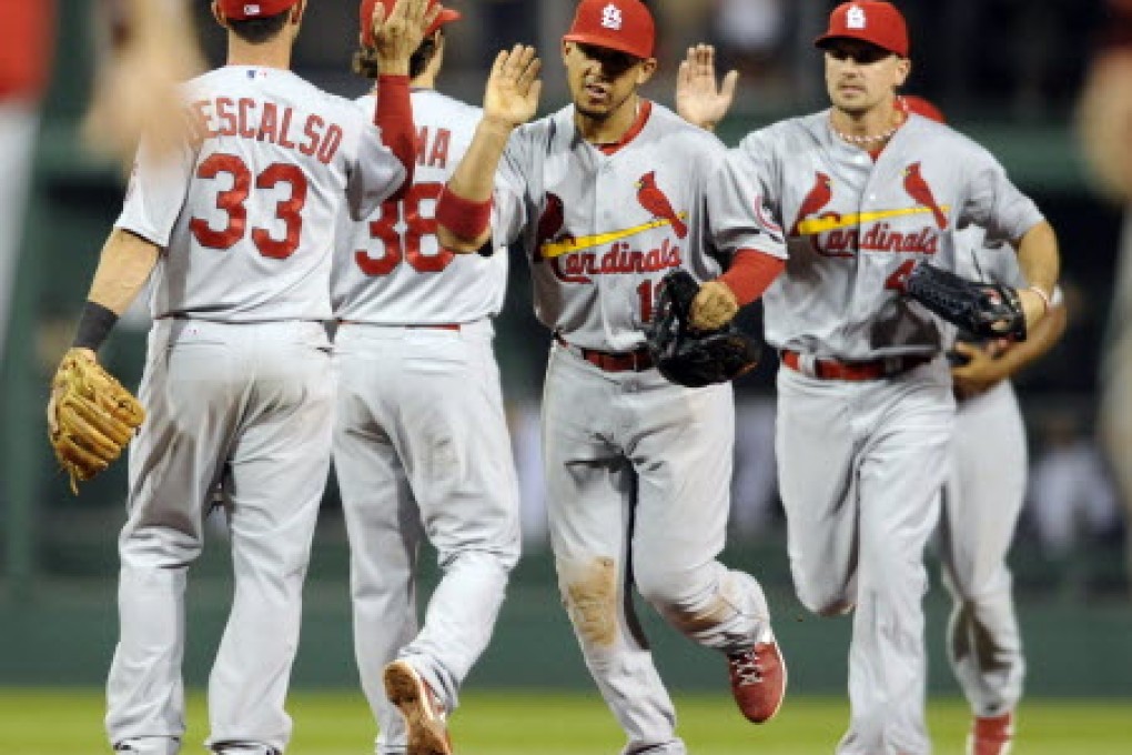 St Louis Cardinals celebrate their 13-0 victory over the Pittsburgh Pirates in their National League MLB baseball game in Pittsburgh in Pennsylvania. Photo: Reuters