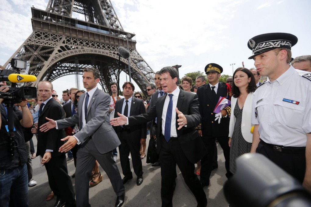 Interior Minister Manuel Valls (centre) and Tourism Minister Sylvia Pinel (second right) take a tour focused on security. Photo: Reuters