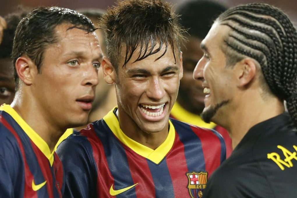 Neymar (centre) celebrates with teammates after his new team's thrashing of his former side, Santos, in Barcelona. Photo: Xinhua