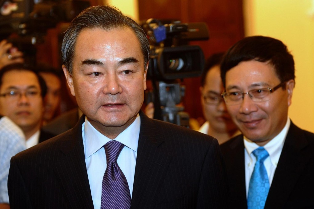 Wang Yi (left)