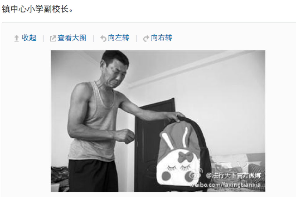 The girl's grandfather holding her schoolbag. Screenshot from Sina Weibo.